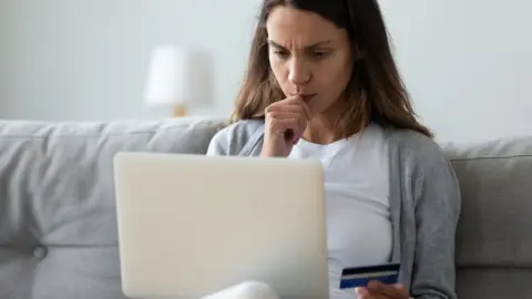 Getty Images Woman looking at laptop