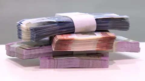 BBC Pile of bank notes