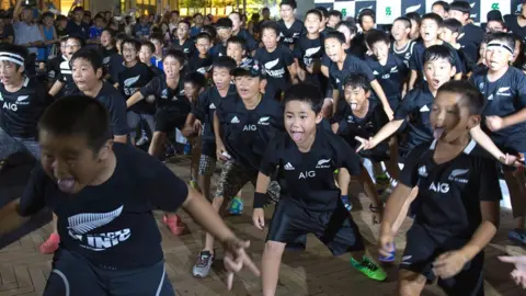 AFP Japanese children perform the Haka during a welcome ceremony for the New Zealand All Blacks team