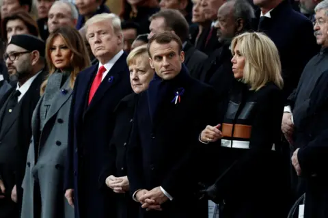Reuters Brigitte Macron, French President Emmanuel Macron, German Chancellor Angela Merkel, US President Donald Trump and first lady Melania Trump