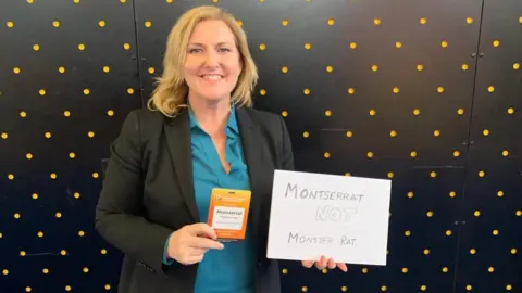 Montserrat Peidro-Insa Montserrat Peidro-Insa holding up a sign saying Montserrat NOT Monster Rat