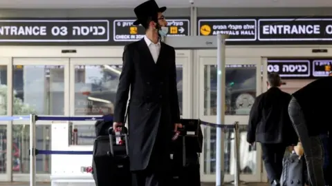 Reuters Passengers at Tel Aviv's airport, Israel. Photo: November 2021