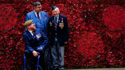 PA Media Army Veteran Clive Jones, Afghanistan Veteran Anthony Cooper, and 98-year-old D-Day Veteran Bernard Morgan