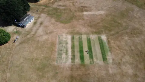 PA Media An aerial view of a dried out cricket field at Boughton and Eastwell Cricket Club in Ashford, Kent