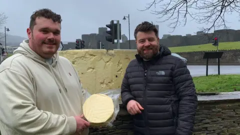 BBC Mr Rowlands and Mr Thomas holding their Caerphilly cheese