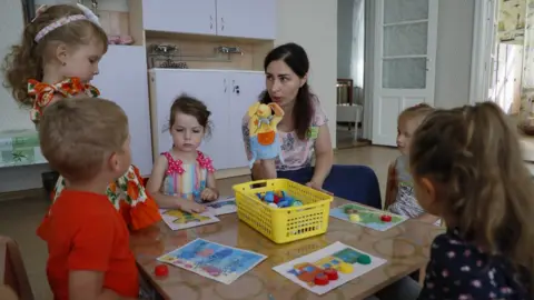 EPA A picture taken during a visit to Berdyansk organized by the Russian military shows children at a newly opened kindergarten in Berdyansk, Zaporizhia region