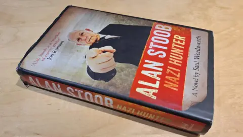 Jon Welch/BBC Saul Wordsworth's book Alan Stoob: Nazi Hunter