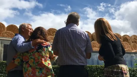 BBC Residents looking at the bales