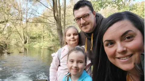 FAMILY PHOTO Tara with her husband John and their children Frankie, 9, and Taya, 8.