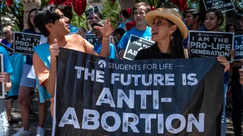 Getty Images Pro-life protesters stand near the gate of the Texas state capitol at a protest outside the Texas state capitol on 29 May 2021 in Austin, Texas