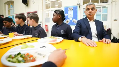 PA Media Photo of Sadiq Khan during a visit to a school in the announcement of his funding.