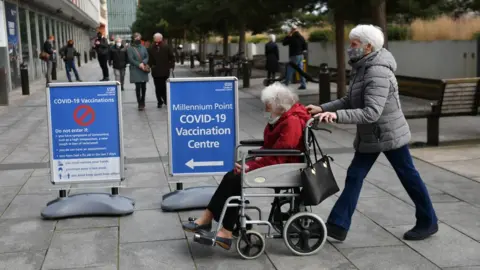 PA Media Members of the public arrive to receive their injection of a Covid-19 vaccine at the NHS vaccine centre that has been set up at the Millennium Point centre in Birmingham.