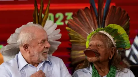 Reuters Brazil's President Luiz Inácio Lula da Silva (left) and indigenous chief Raoni Metuktire in Brasília. Photo: 28 April 2023