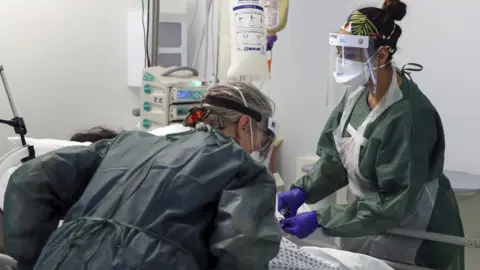 EPA Nurses caring for a patient in ICU