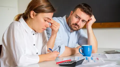 Getty Images Couple dealing with financial stress