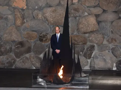 Reuters Prince William stands next to the eternal flame during a ceremony commemorating the six million Jews killed by the Nazis during the Holocaust, in the Hall of Remembrance at Yad Vashem World Holocaust Remembrance Center in Jerusalem