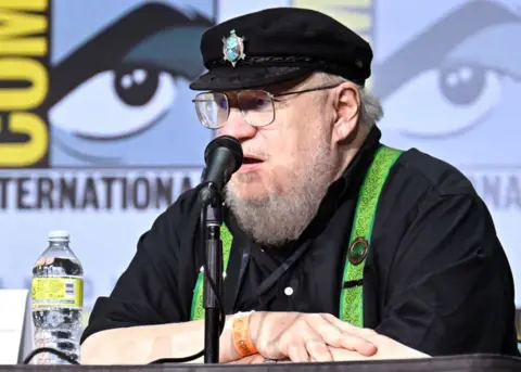 Variety/Getty Images George R.R. Martin speaks during the House of the Dragon panel at the 2022 Comic-Con International in San Diego