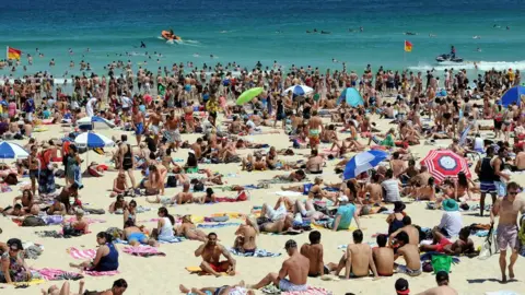 AFP/Getty Images Beachgoers at Bondi Beach in Sydney