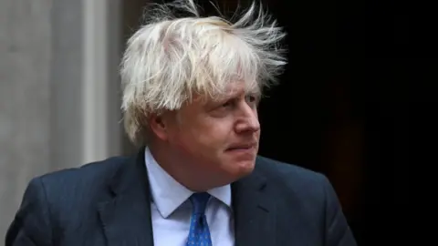 Reuters British Prime Minister Boris Johnson leaves Downing Street 10 to meet with Oman"s Sultan Haitham bin Tariq, in London, Britain December 16, 2021.