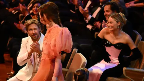 Getty Images Ryan Gosling, Emma Stone and Margot Robbie at the Baftas