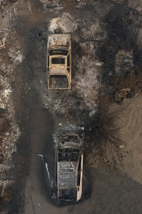 Adrees Latif / Reuters Destroyed cars are seen as the aftermath of the South Obenchain Fire along Butte Falls Highway in Eagle Point, Oregon