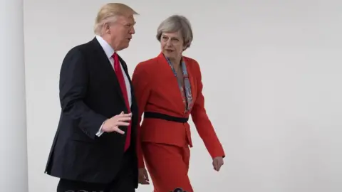 PA Donald Trump and Theresa May