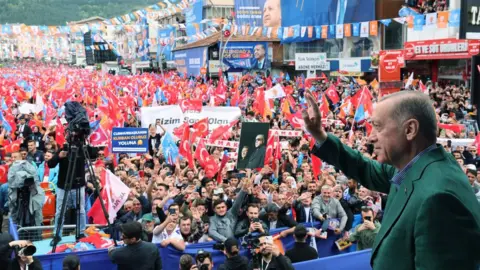 APAImages/Shutterstock Turkish President and Leader of the Justice and Development (AK) Party, Recep Tayyip Erdogan addresses the crowd during election rally, Ankara, Turkey - 11 May 2023