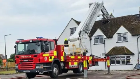 A fire engine outside the Oakwood Inn