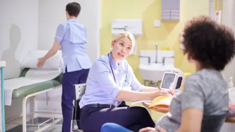 Getty Images Doctor writing prescription