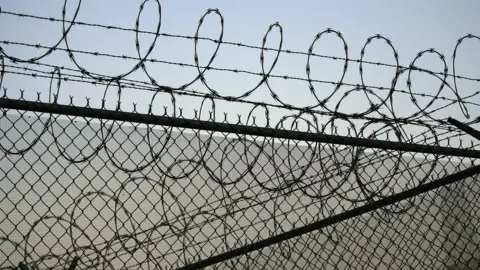 Getty Images Barbed perimeter wire at Santa Barbara prison, California