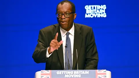 Getty Images Chancellor of the Exchequer Kwasi Kwarteng delivers his keynote address on the second day of the annual Conservative Party Conference in Birmingham.