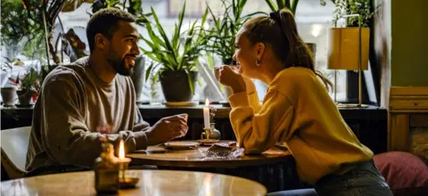 Getty Images Couple on a weekend date at cafe