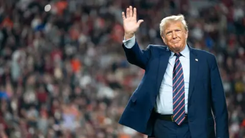 Getty Images Trump on 25 November attending a football game in South Carolina