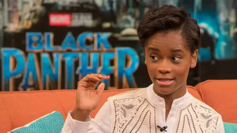 Getty Images Letitia Wright promoting the original Black Panther film in 2018