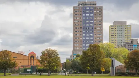 Victor Huang/Getty Images The existing coloured high-rise Broadwater Farm estate blocks