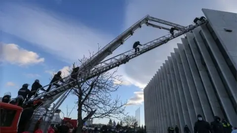 Reuters Georgian law enforcement officers enter the United National Movement (UNM) opposition party office in Tbilisi, Georgia 23 February 2021