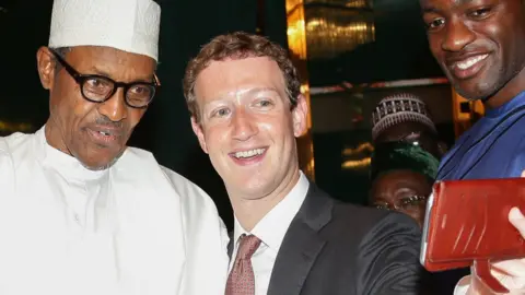 AFP Nigeria's President Muhammadu Buhari (L) and Facebook head Mark Zuckerberg pictured in 2016