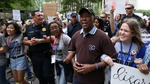 Reuters Houston Mayor Sylvester Turner, Houston Police Chief Art Acevedo and student organizers lead the "March for Our Lives", an organized demonstration to end gun violence, in downtown Houston, Texas, on 24 March 2018.