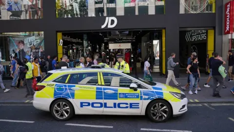 AFP There has been a large police presence on Oxford Street this afternoon