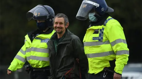 Getty Images/Peter Summers Dan Hooper, better known as Swampy is removed by police in Jones Hill Wood