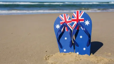 Getty Images Australian flag sandals on a beach