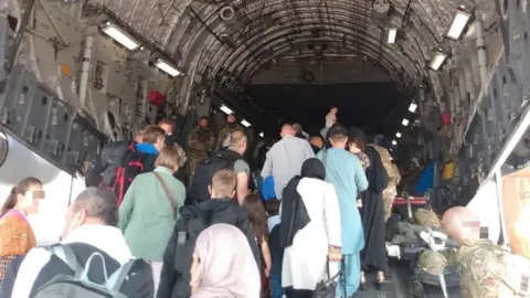 Kitty Chevallier/PA Media People on an RAF evacuation flight