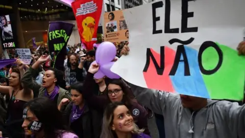 AFP Demonstrators take part in a women protest against Brazilian right-wing presidential candidate Jair Bolsonaro called by a social media campaign under the hashtag #EleNao (Not Him) in Sao Paulo, Brazil, on October 6, 2018.