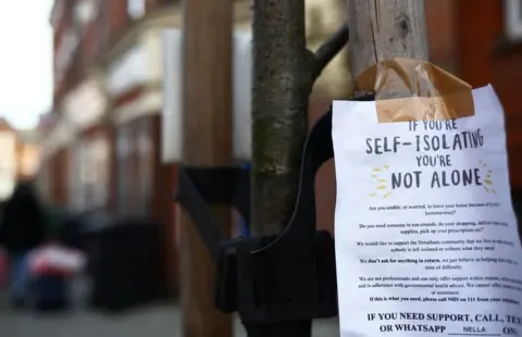 Reuters A sign is seen down a London street regarding self isolation as the spread of the coronavirus disease (COVID-19) continues. London,