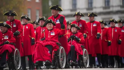 PA Media Chelsea Pensioners at the Saluting Base in Horse Guards during the Remembrance Sunday service at the Cenotaph, in Whitehall, London