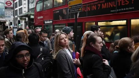 Getty Images People queuing for bus