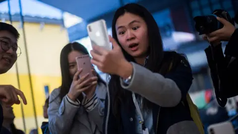 AFP Woman reacts to new iPhone X