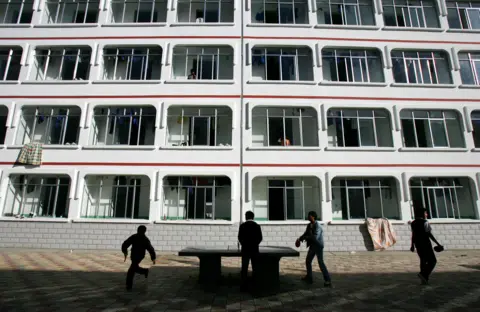 Getty Images Tibetan students play table tennis in front of a dormitory at Nyingchi First High School, the only high school of Nyingchi Prefecture, on October 29, 2006 in Nyingchi County of Tibet Autonomous Region, China.