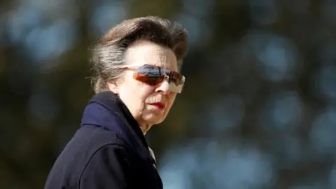 Reuters Princess Anne looks on as she visits the Royal Yacht Squadron, after Prince Philip, husband of Queen Elizabeth, died at the age of 99, in Cowes on the Isle of Wight