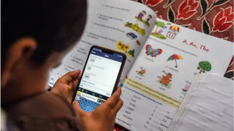 Getty Images A child attends an online class on Zoom